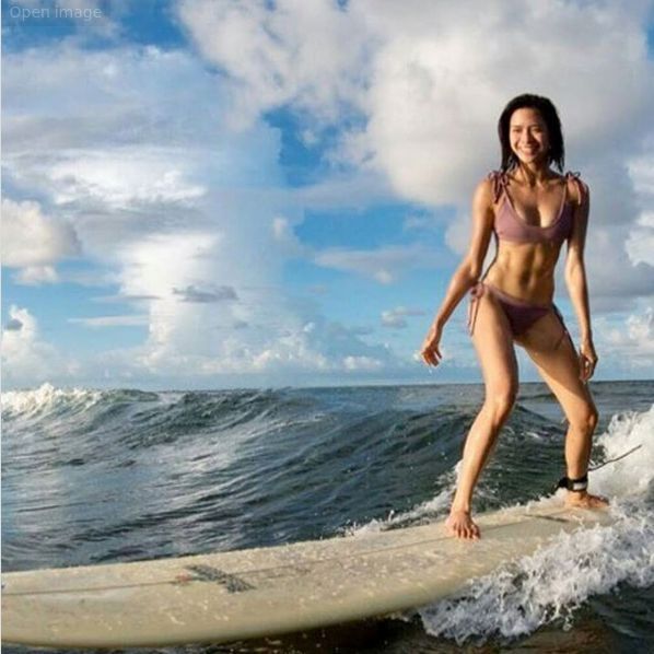 Sexy Surfing Filipina Riding A Wave